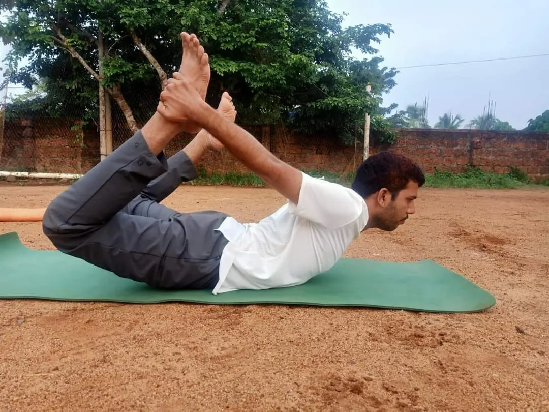 Client holding bow pose
